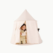 Cream@little girl playing in cream tent