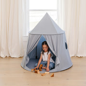 Ocean@Lifestyle image of little girl playing in tent
