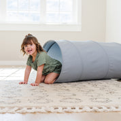 Ocean@little girl playing in tunnel