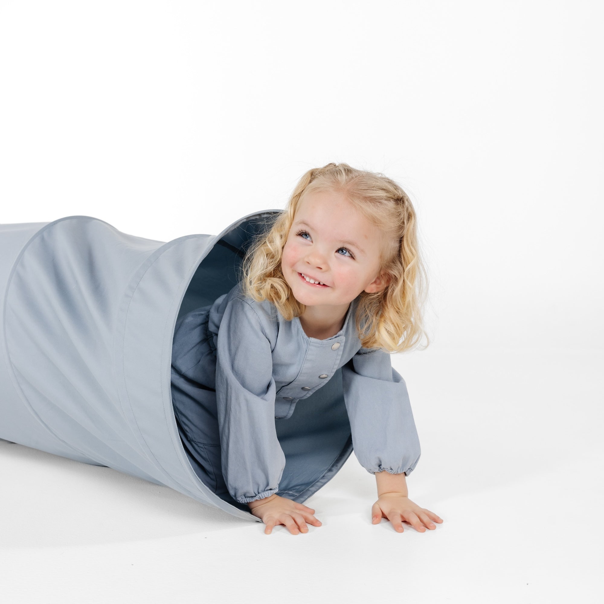 Ocean@little girl playing in tunnel