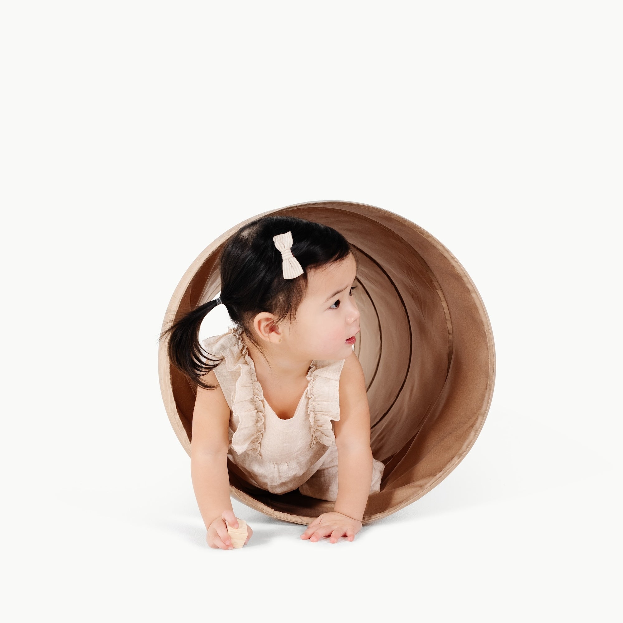 Sand@little girl playing in tunnel